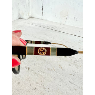 Gucci GG0597S Black Acetate Yellow Lens Cat Eye Sunglasses