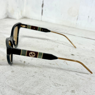 Gucci GG0597S Black Acetate Yellow Lens Cat Eye Sunglasses