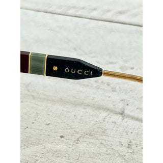 Gucci GG0597S Black Acetate Yellow Lens Cat Eye Sunglasses