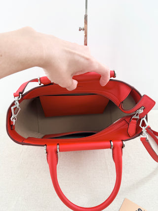 Max Mara structured leather tote bag featuring dual top handles, and detachable shoulder strap