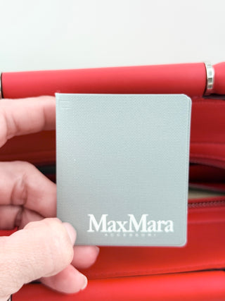 Max Mara structured leather tote bag featuring dual top handles, and detachable shoulder strap