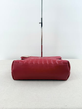 YSL Lolou shoulder bag crafted in quilted lambskin leather with signature stitching and YSL hardware, finished with sliding chain-and-leather shoulder straps