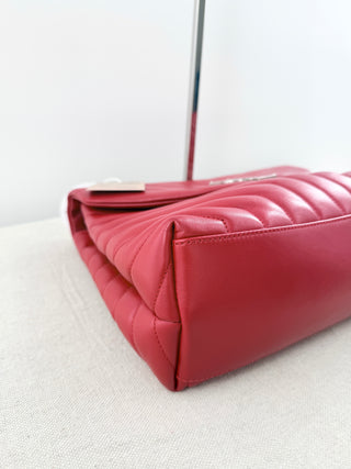 YSL Lolou shoulder bag crafted in quilted lambskin leather with signature stitching and YSL hardware, finished with sliding chain-and-leather shoulder straps