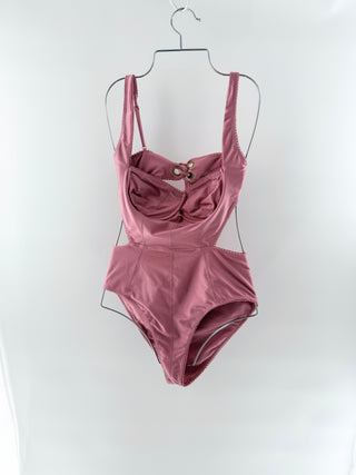 Tularosa one-piece swimsuit features  structured underwire cups with subtle ruching and a front lace-up detail and a flattering peplum-style waist, M