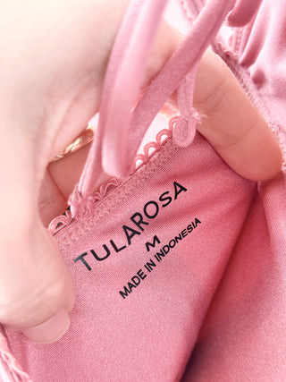Tularosa one-piece swimsuit features  structured underwire cups with subtle ruching and a front lace-up detail and a flattering peplum-style waist, M
