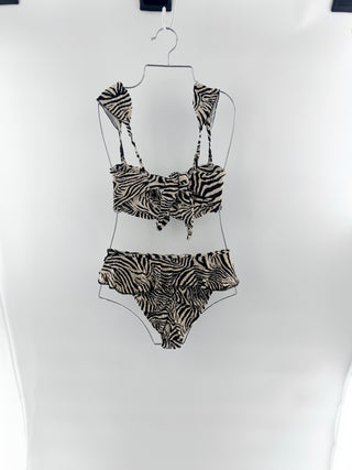 Montce bold, feminine, crinkled, ribbed fabric bikini, top features a bandeau style with thick shoulder straps and dramatic center knot detail and bottoms are high-waisted with a flattering high-cut leg and a flirty ruffle trim along the waistband, top S