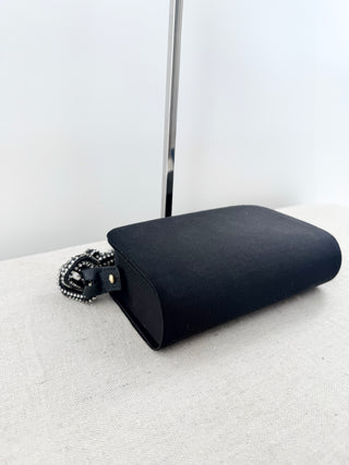 serena uziyel satin clutch featuring statement crystal-beaded top handle with chain-link inspired detailing