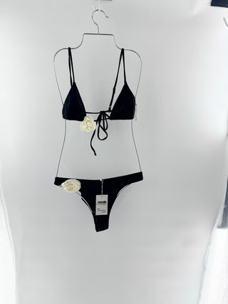 Lovers and Friends sleek, feminine two-piece with statement floral accents. Top is a minimal triangle style with thin adjustable straps and large rosette applique and bottoms are matching high-cut style with rosette at the hip, S/M