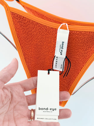 Bond eye vibrant textured bikini set featuring a soft crinkle-knit fabric, top has a scoop neckline with slim adjustable straps while the matching bottom is high-cut with minimal coverage, S