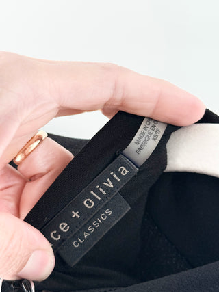 Alice & Olivia Black partial zip-up, puffed shoulders, XS