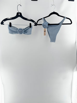 Same textured bikini set featuring oversized bandeau top with statement rosette detailing and matching high-cut bottoms with coordinating floral accents, top S / bottom M