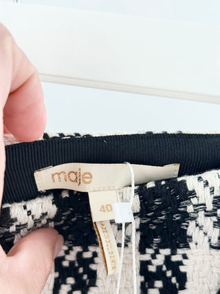 Maje tweed skort featuring textured houndstooth-inspired weave, contrast ribbon waistband detailing, and tailored pleated style with built-in shorts, 40