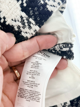 Maje tweed skort featuring textured houndstooth-inspired weave, contrast ribbon waistband detailing, and tailored pleated style with built-in shorts, 40