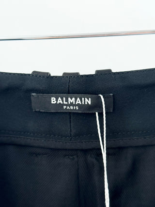 Balmain leather trousers featuring high-rise waist, structured pleated front detailing, and cropped culotte-style hem, 38