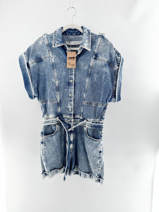 IRO acid wash denim romper featuring collared neckline. snap-front closure, rolled short sleeve, adjustable waist belt in cotton denim, 38