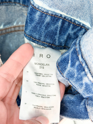 IRO acid wash denim romper featuring collared neckline. snap-front closure, rolled short sleeve, adjustable waist belt in cotton denim, 38