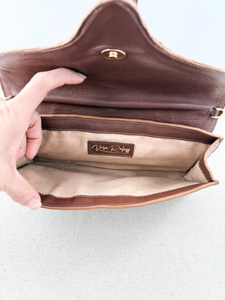 Vera Roloff textured leather clutch bag with wristlet chain