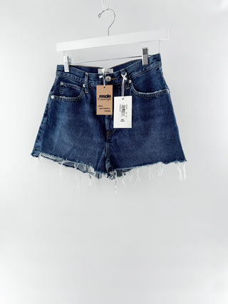 Frame THE DARE SHORT featuring a mid-rise waist, classic five-pocket styling, and distressed detailing, finished with a frayed raw hem, 26