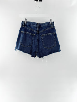 Frame THE DARE SHORT featuring a mid-rise waist, classic five-pocket styling, and distressed detailing, finished with a frayed raw hem, 26