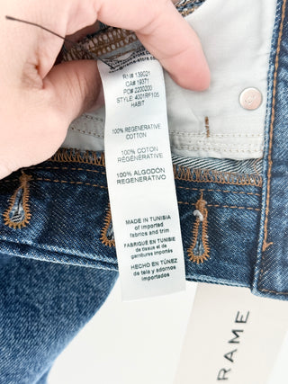 Frame THE DARE SHORT featuring a mid-rise waist, classic five-pocket styling, and distressed detailing, finished with a frayed raw hem, 26