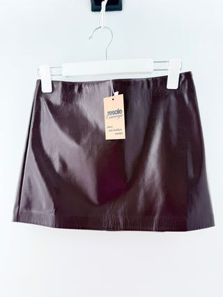 Joe's faux leather mini skirt featuring a smooth high-rise waistband and a sleek straight silhouette, finished with a glossy-patent style, 2