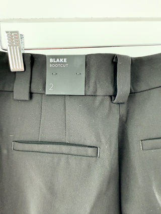 White house black market BLAKE tailored trousers featuring a mid-rise waistband with belt loops, side slant pockets, and a concealed zip closure, finished with a bootcut, 2