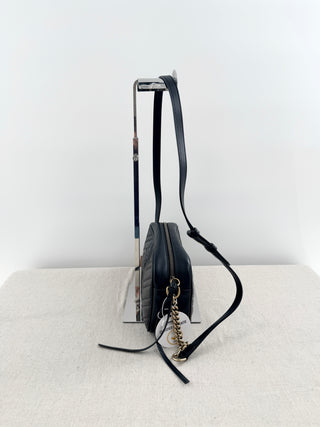 Gucci GG marmont camera bag in matelasse chevron leather with antique gold hardware and chain strap detailing