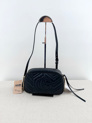 Gucci GG marmont camera bag in matelasse chevron leather with antique gold hardware and chain strap detailing