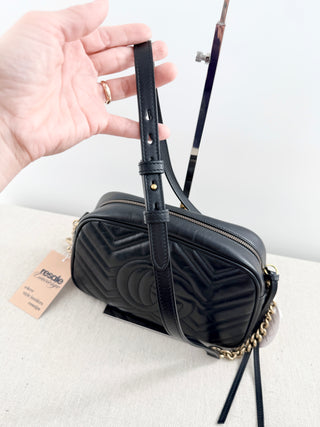 Gucci GG marmont camera bag in matelasse chevron leather with antique gold hardware and chain strap detailing