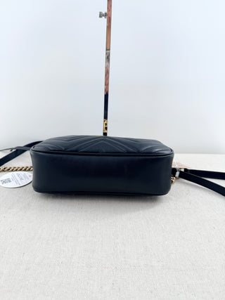 Gucci GG marmont camera bag in matelasse chevron leather with antique gold hardware and chain strap detailing