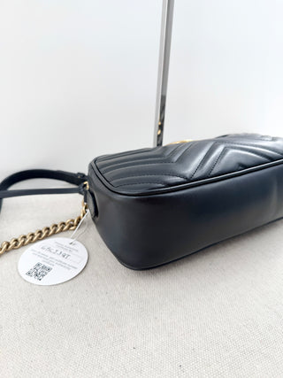 Gucci GG marmont camera bag in matelasse chevron leather with antique gold hardware and chain strap detailing