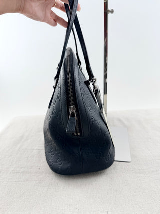 Gucci guccissima leather embossed dome satchel bag with long strap
