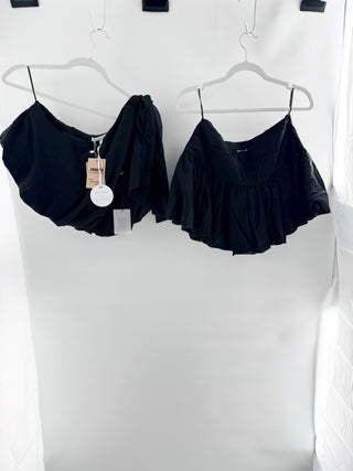 More To Come two-piece set featuring asymmetrical one-shoulder top with oversized bow accent and coordinating high-rise skirt with gathered ruffle detailing in lightweight fabric, S