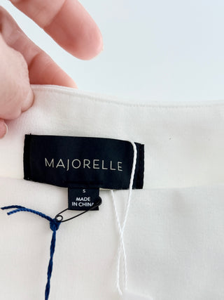 Majorelle sleeveless boat neckline, fitted ruched waist detailing, and softly flared mini skirt in a structured stretch fabric, S
