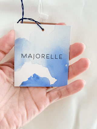 Majorelle sleeveless boat neckline, fitted ruched waist detailing, and softly flared mini skirt in a structured stretch fabric, S