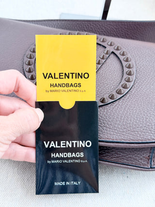 Valentino by Mario Valentino leather flap bag with studded logo and shoulder strap