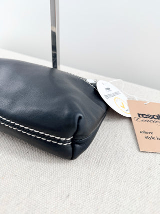 CHANEL vintage leather chain shoulder bag featuring embossed tonal CHANEL logo across front with contrast stitching and leather-threaded chain straps