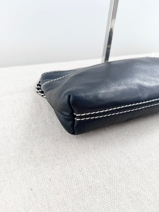 CHANEL vintage leather chain shoulder bag featuring embossed tonal CHANEL logo across front with contrast stitching and leather-threaded chain straps