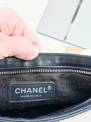 CHANEL vintage leather chain shoulder bag featuring embossed tonal CHANEL logo across front with contrast stitching and leather-threaded chain straps