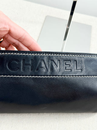 CHANEL vintage leather chain shoulder bag featuring embossed tonal CHANEL logo across front with contrast stitching and leather-threaded chain straps