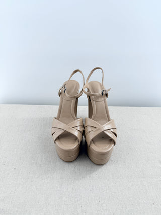 Schutz Keefa platform sandals in leather featuring padded crisscross front straps, adjustable slingback strap, chunky block heel, 6