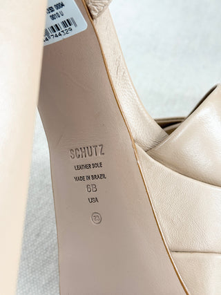 Schutz Keefa platform sandals in leather featuring padded crisscross front straps, adjustable slingback strap, chunky block heel, 6