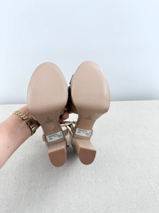 Schutz Keefa platform sandals in leather featuring padded crisscross front straps, adjustable slingback strap, chunky block heel, 6