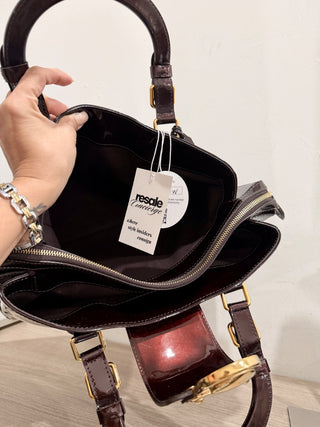 Louis Vuitton patent leather monogram print handbag in amarante