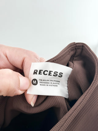 recess pickleball cropped long-sleeve polo top featuring classic collar, partial button placket and matching high-rise pleated tennis skirt with built-in shorts, XS