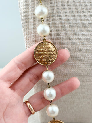 Chanel vintage long faux pearls and gold medal Chanel embossed necklace