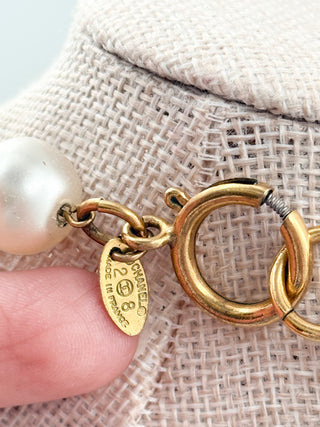 Chanel vintage long faux pearls and gold medal Chanel embossed necklace