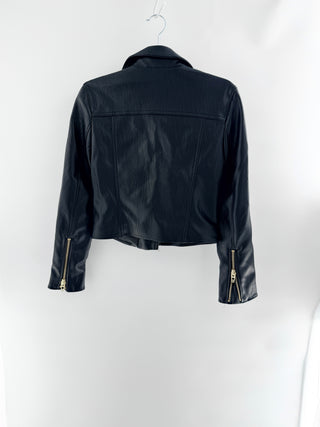 Blank NYC faux leather moto jacket featuring asymmetrical zip-front closure, oversized lapels, zippered pockets, XS