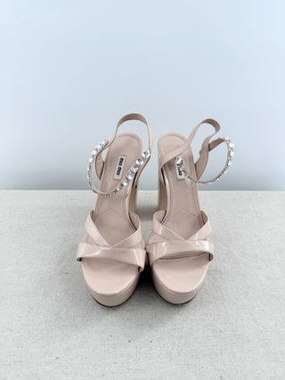 Miu Mu platform sandals in patent leather featuring crystal-embellished ankle straps, crisscross vamp detailing, and statement block heel, 41