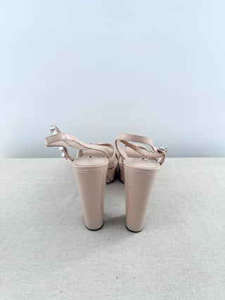 Miu Mu platform sandals in patent leather featuring crystal-embellished ankle straps, crisscross vamp detailing, and statement block heel, 41